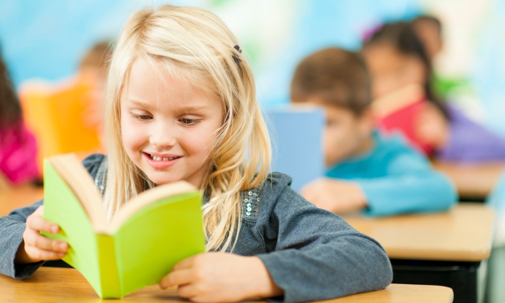 0413_638441706852315506 A teacher exemplifying one of the 10 essential classroom management skills as her class is focused and organised.