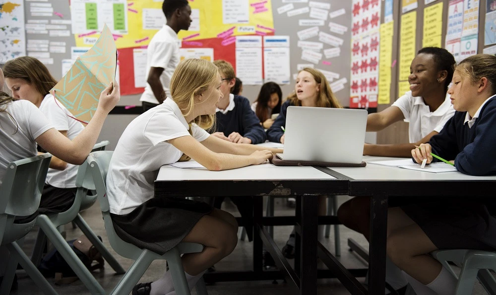 highschool-students A teacher exemplifying one of the 10 essential classroom management skills as her class is focused and organised.