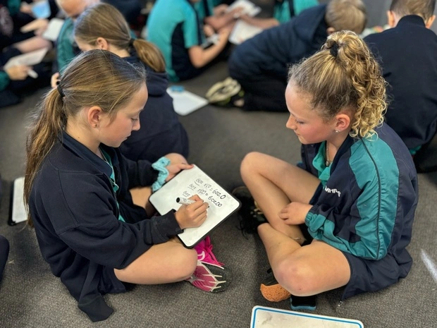 newcastle primary A teacher exemplifying one of the 10 essential classroom management skills as her class is focused and organised.
